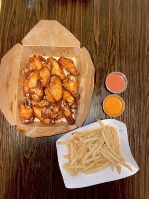 Lemon Lime wings with garlic parm fries and chipotle raspberry + orange soda sauce