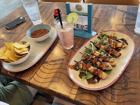 Happy Hour chips and dip (choice of salsa, queso, or guacamole), and Jerk chicken skewers. Watermelon margarita.