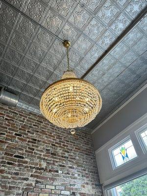 Historic building with exposed brick, stained glass and beautiful chandeliers.