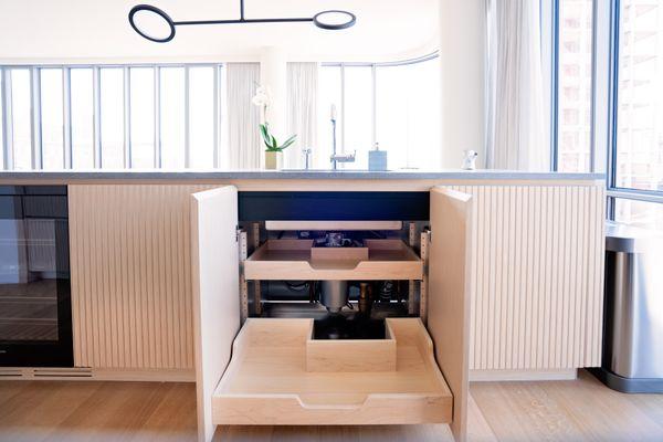 Maximize your kitchen sink cabinet with pull out shelves that works around your plumbing!