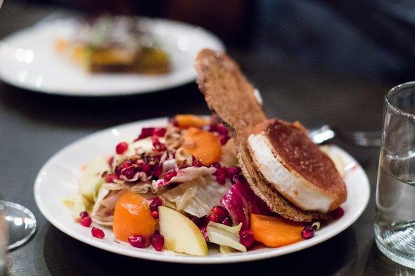 Seared Caña de Cabra Goat Cheese, Chicories, Persimmons, Pomegranates, Hazelnuts