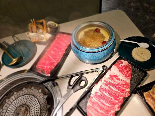 Chinese Herb broth hotpot. Have meat slices for the grill.