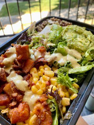 Custom Salad with corn, sweet potato, lemon quinoa, avo, and cashew Caesar