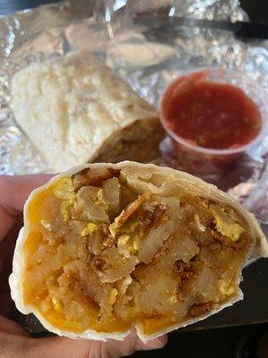 Breakfast burrito - bacon, homestyle potatoes, cheese, and eggs with a side of salsa