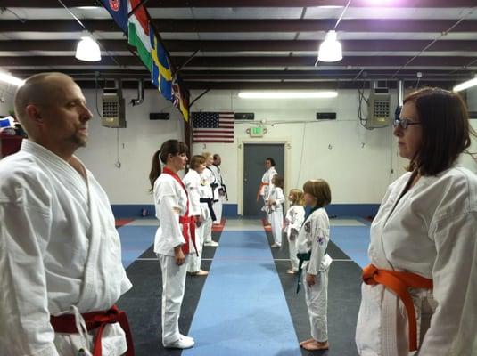 Lining up in our dojang for practice with a partner