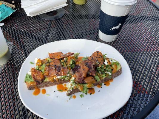 Avocado toast with bacon added on top