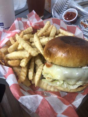 Cheeseburger with Swiss cheese and French fries