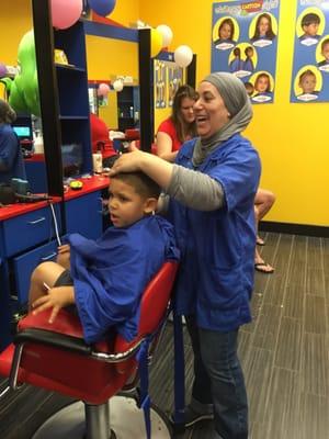 Amina cutting our sons hair