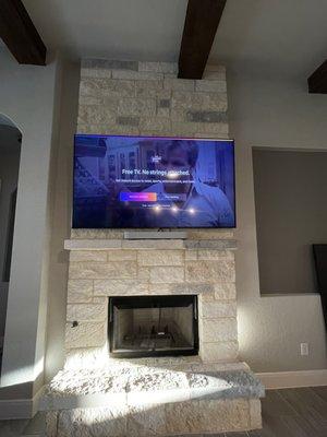 75 inch tv above the fireplace