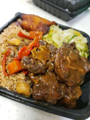 Oxtails...stream cabbage...red beans and rice...fried plantains...absolutely yummilicious