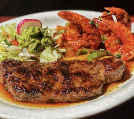 Our delicious Tierra y Mar...juicy carne asada grilled to taste served with jumbo shrimp, ranchero style