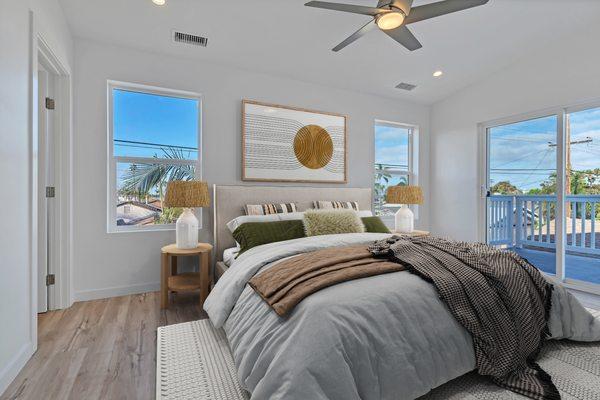 Primary bedroom with balcony