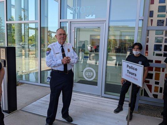 Police chaplain offering tours of the new police building.