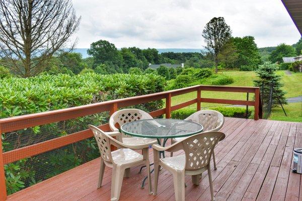 The view each morning on the dog friendly "deleware unit" with fenced in porch and privacy bushes.