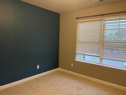 Painted accent wall and three grey walls