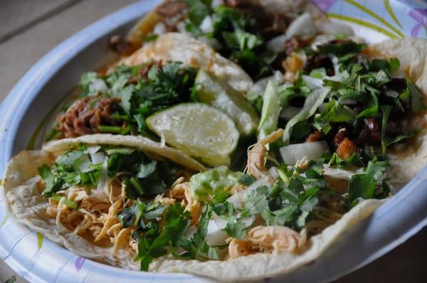 chicken, tongue and al pastor tacos.