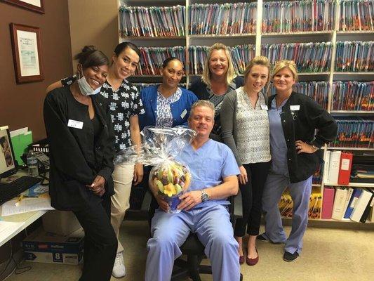 Dr Vlad and staff. Posed with Edible Arrangements basket that was given to us by a patient. Grateful. :)