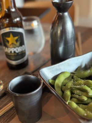 Edamame and hot sake. Salt used is not your regular everyday variety. Simply delicious