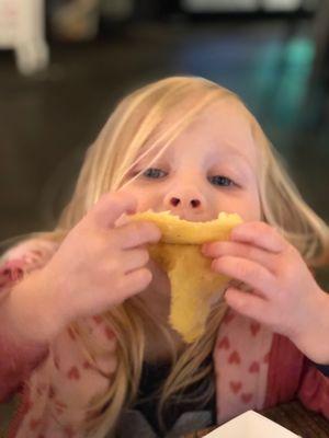 Digging into the cheese quesadilla