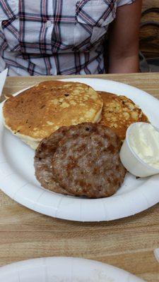 Fluffy pancakes and side of sausage.