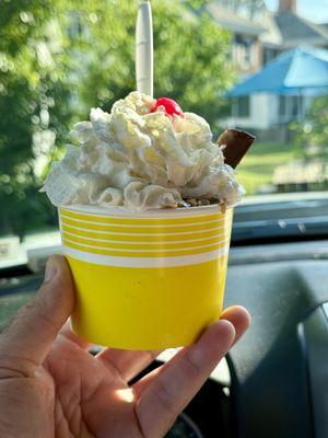 Sticky Fingers Sundae (vanilla ice cream, hot caramel, butterfinger, whip cream, nuts and a cherry)