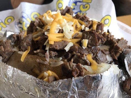 Baked potato with carne asada