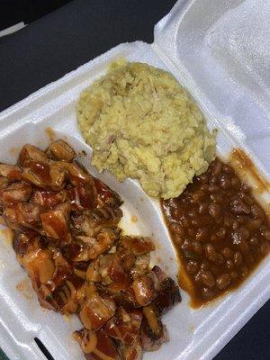 Rib Bites served with chicken & rice and baked beans.