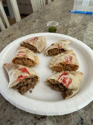 Food I ordered cut in half to show fillings (in same order as the previous photo of the whole empanadas)