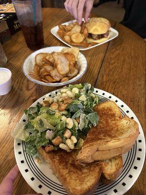 Grilled cheese, screwdriver Caesar salad, homemade potato chips, and a bacon cheeseburger.