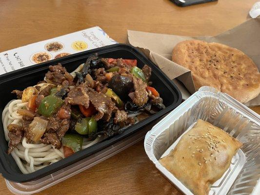 Handmade noodle with Uyghur stir-fried lamb, traditional Uyghur bread, and baked bun filled with meat!