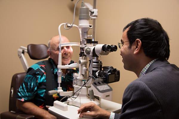 Dr. Sajja examining a patient.