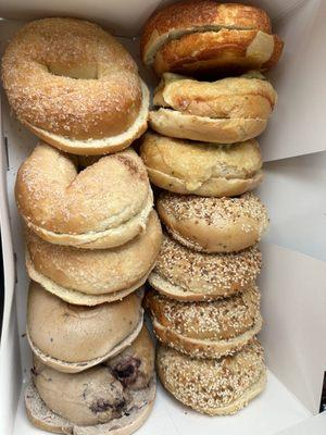 One dozen bagels, the Works, jalapeño cheddar, cheddar, blueberry, and cinnamon sugar.