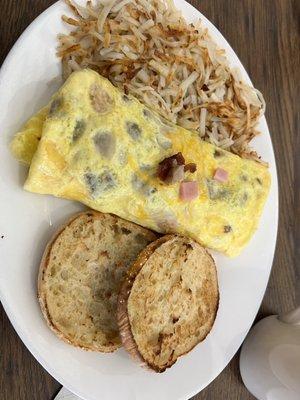 Meat lovers omelet with hash browns and English muffin. Sooo good!