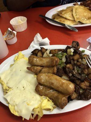 Scrambled eggs with cheese and onions sausage with home fries with onions and green peppers