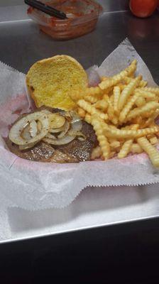 Ribeye Sandwich with Grilled onions and french fries