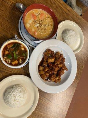 Tom yum soup, orange chicken, massaman curry.