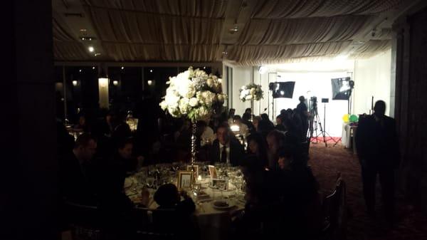 shot of the booth in the distance inside a beautiful reception!