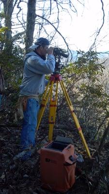 Boundary Re-tracement utilizing original surveying techniques.