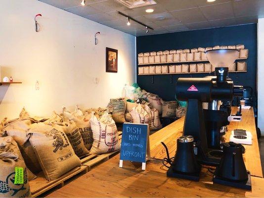 Bags of Green coffee beans waiting to be roasted.