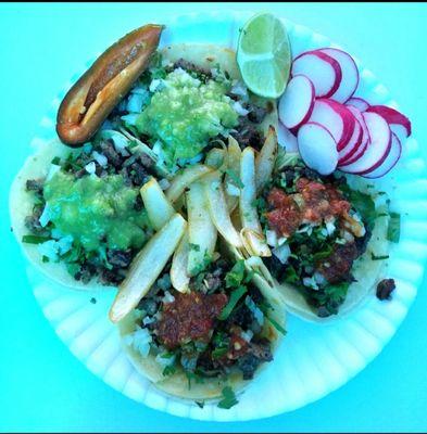 2 Tacos de asada and 2 alpastor. 
With frilled onions at your choice and radishes if you want.