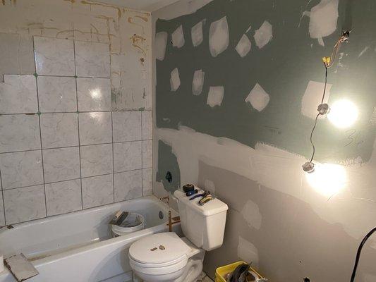 New drywall in complete bathroom during renovation.