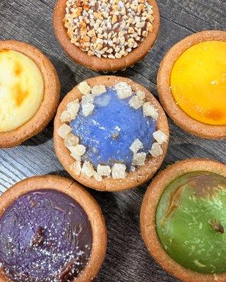 Chocolate, mango, matcha, ube, original and butterfly pea lemon