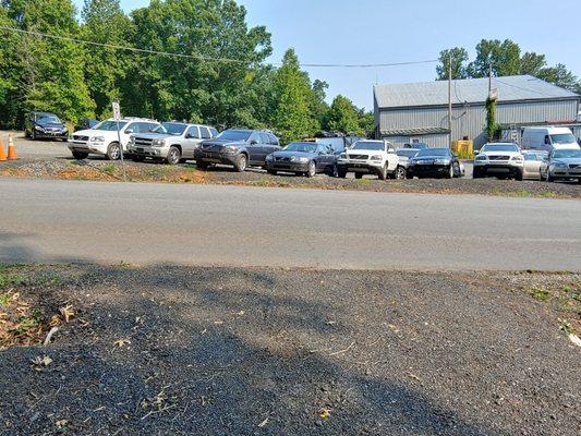 Used Volvo inventory in front of the sales and repair shop.