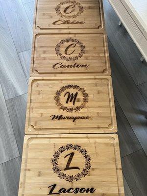 These are large cutting boards bought online made of bamboo. Susan engraved the names and design.