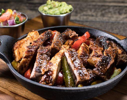 Carne Asada Fajitas.

Corn or flour tortillas, black beans, cilantro-lime rice, fajita veggies, sour cream, and guacamole.