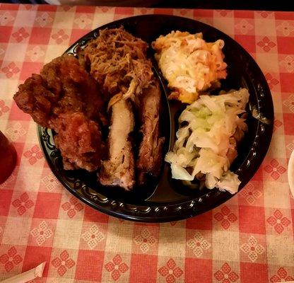 Fried Chicken,  pulled pork, pork ribs, mac n cheese and cabbage.