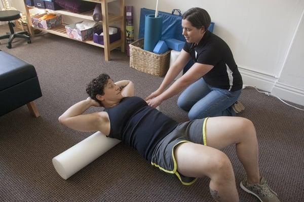 Foam roller exercise to mobilize thoracic spine.