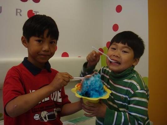 The kids trying our soon-to-be-on-the-menu shaved ice, delish!