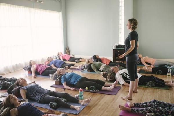 Kristen leading a Therapeutic Yoga class at COIL Yoga