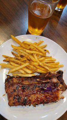 Small rack of ribs with french fries.